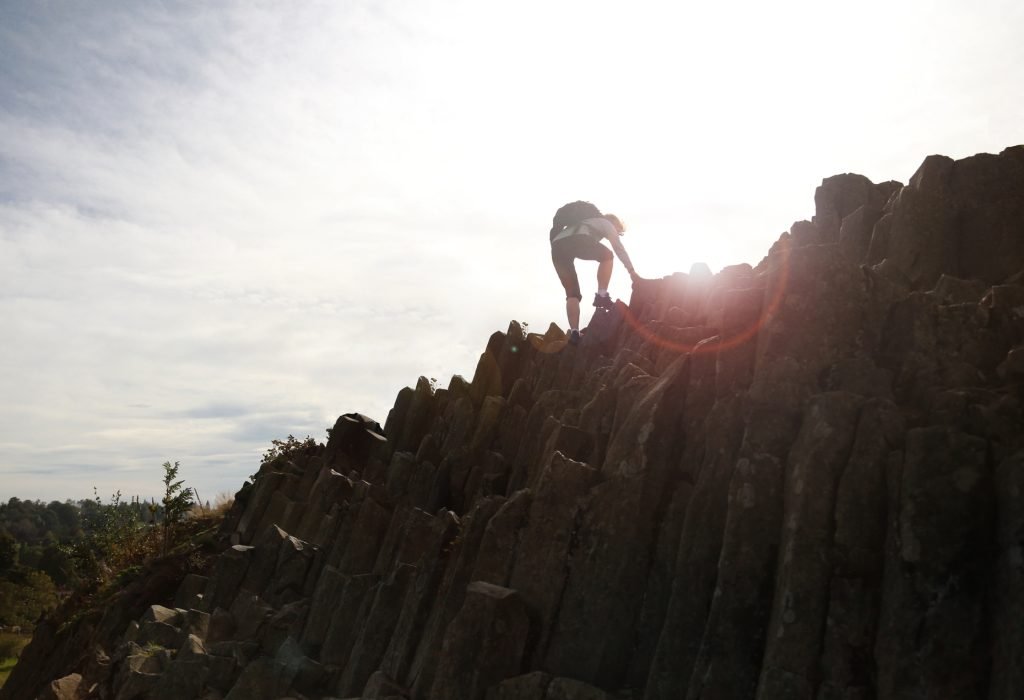 woman-with-a-backpack-climbs-a-rock-2022-11-16-09-07-11-utc (1)